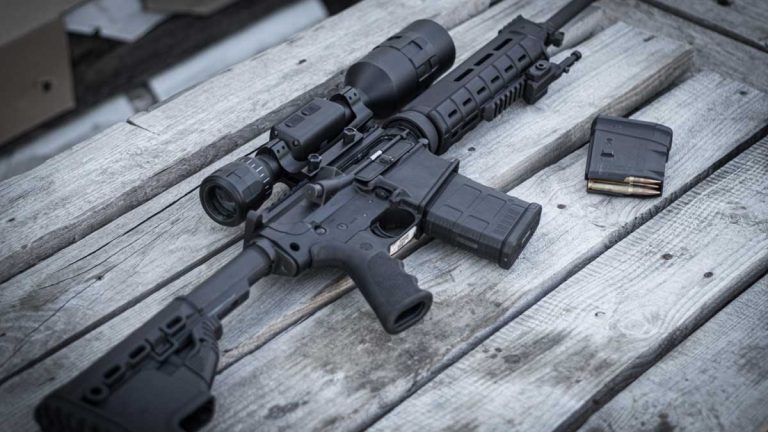 An image of an AR-15 and a loaded magazine