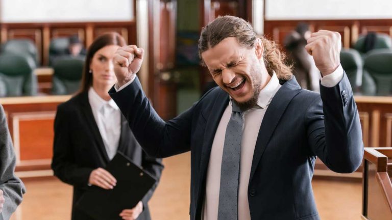 A generic image of a person victorious in the courtroom.