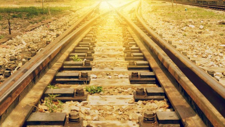An image of two train tracks merging