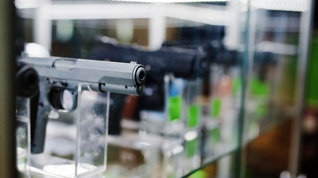 Handguns in a display case at a gun shop