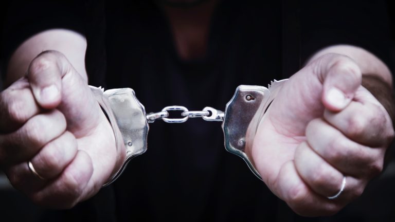 Hands in handcuffs
