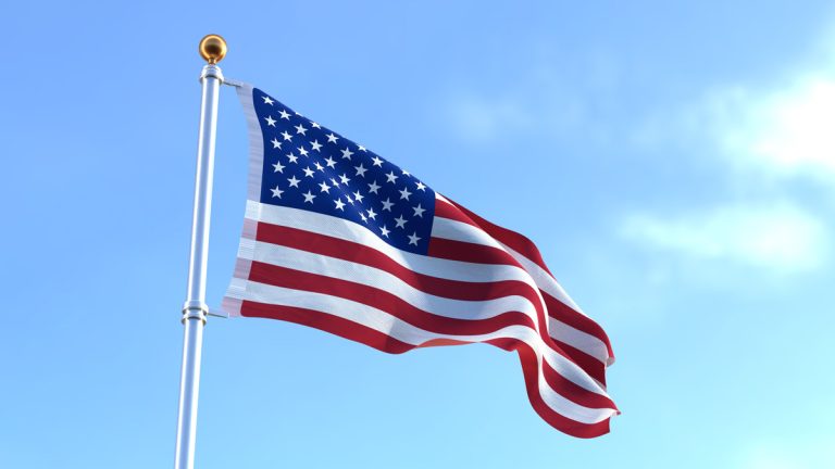 The American flag blowing in the wind