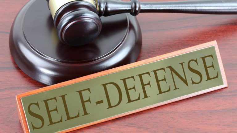 A gavel and a sign that