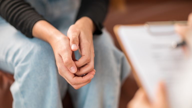 A person talking to a psychologist