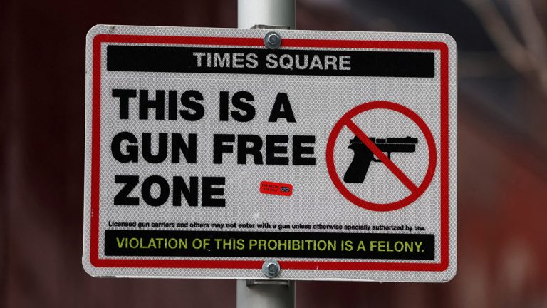 A 'gun free zone' sign, as posted in several locations throughout NYC's Times Square