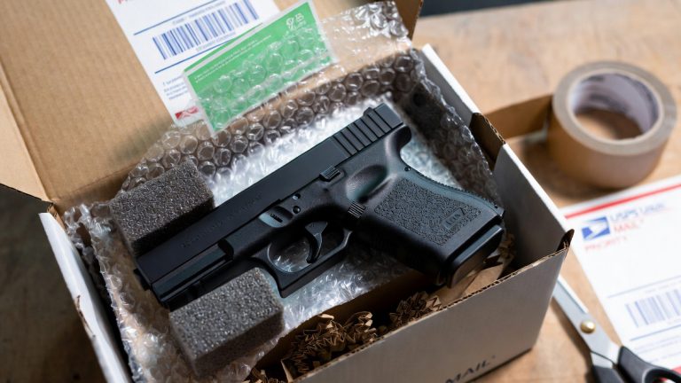 A Glock handgun being packed for mailng
