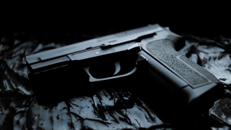 A handgun on a dark background